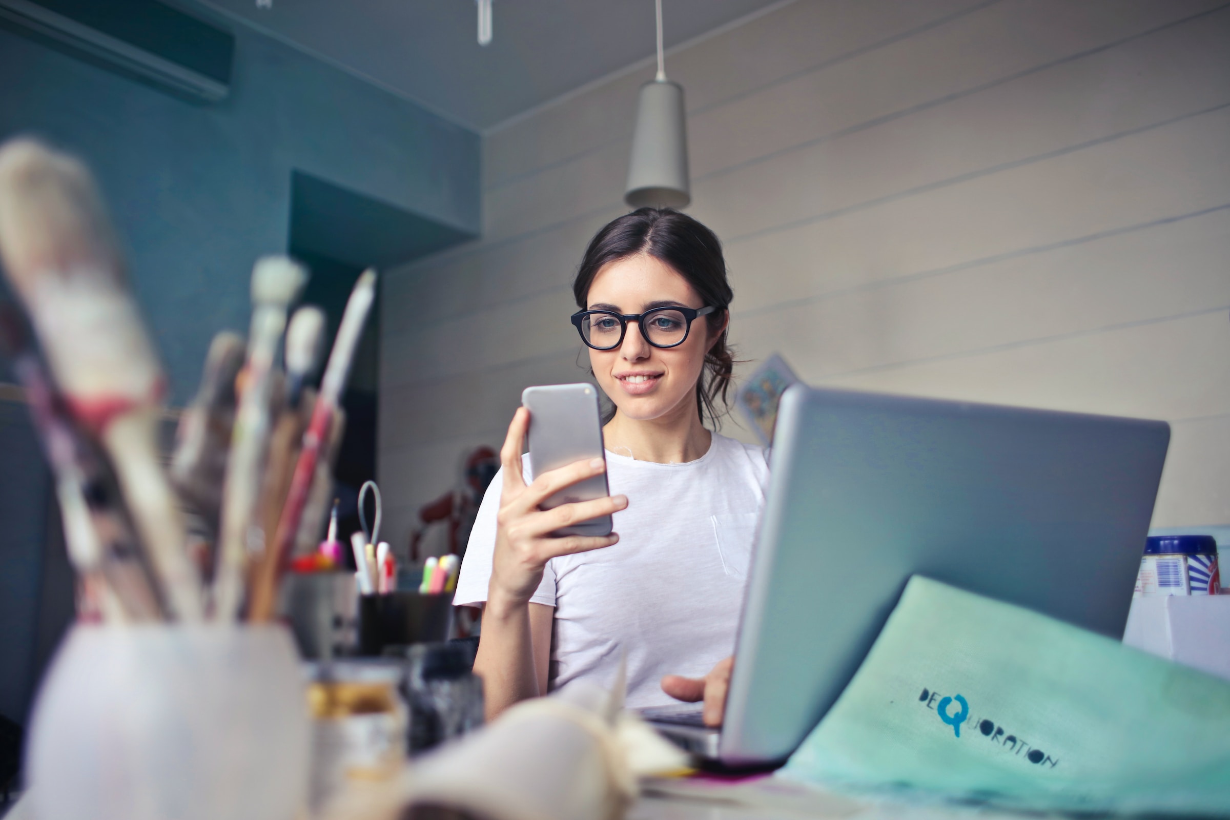 An image of a woman looking at her phone.